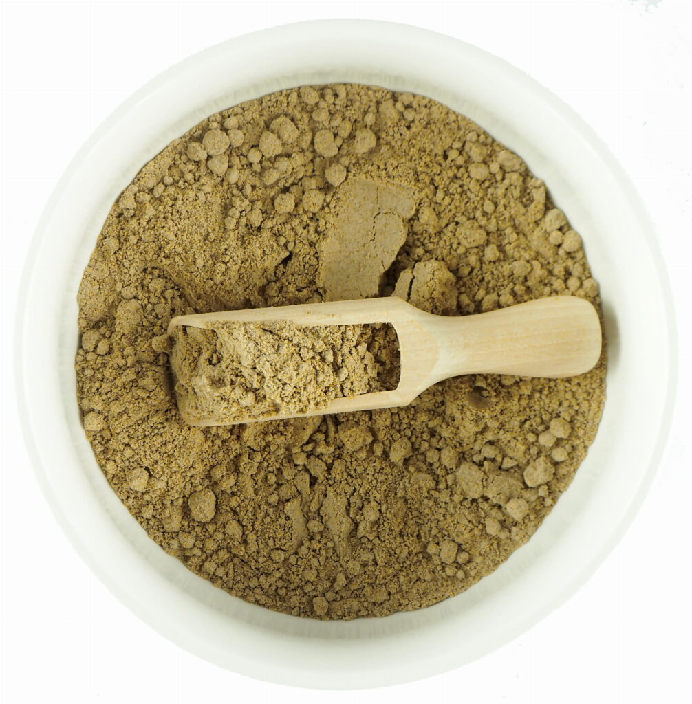 milk thistle, silybum marianum, powder in a bowl with spoon